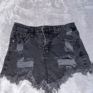 black ripped shorts